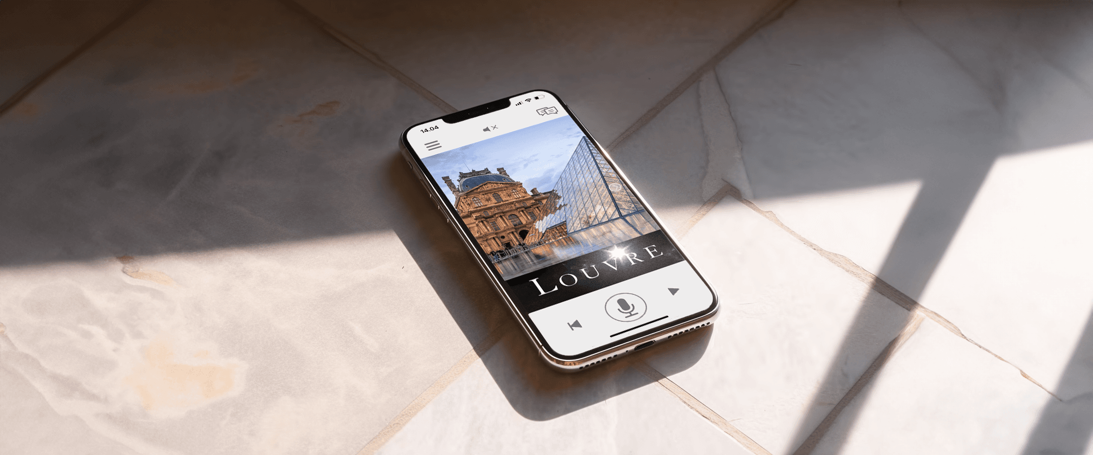Smartphone displaying AITourPilot app on a plaster surface